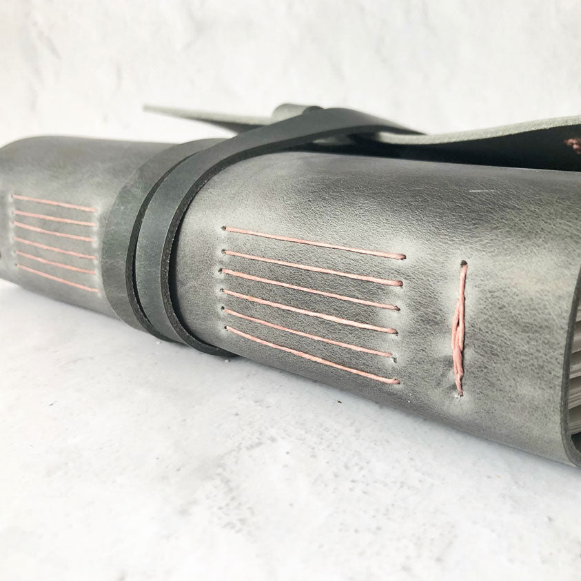 grey leather journal with rose binding