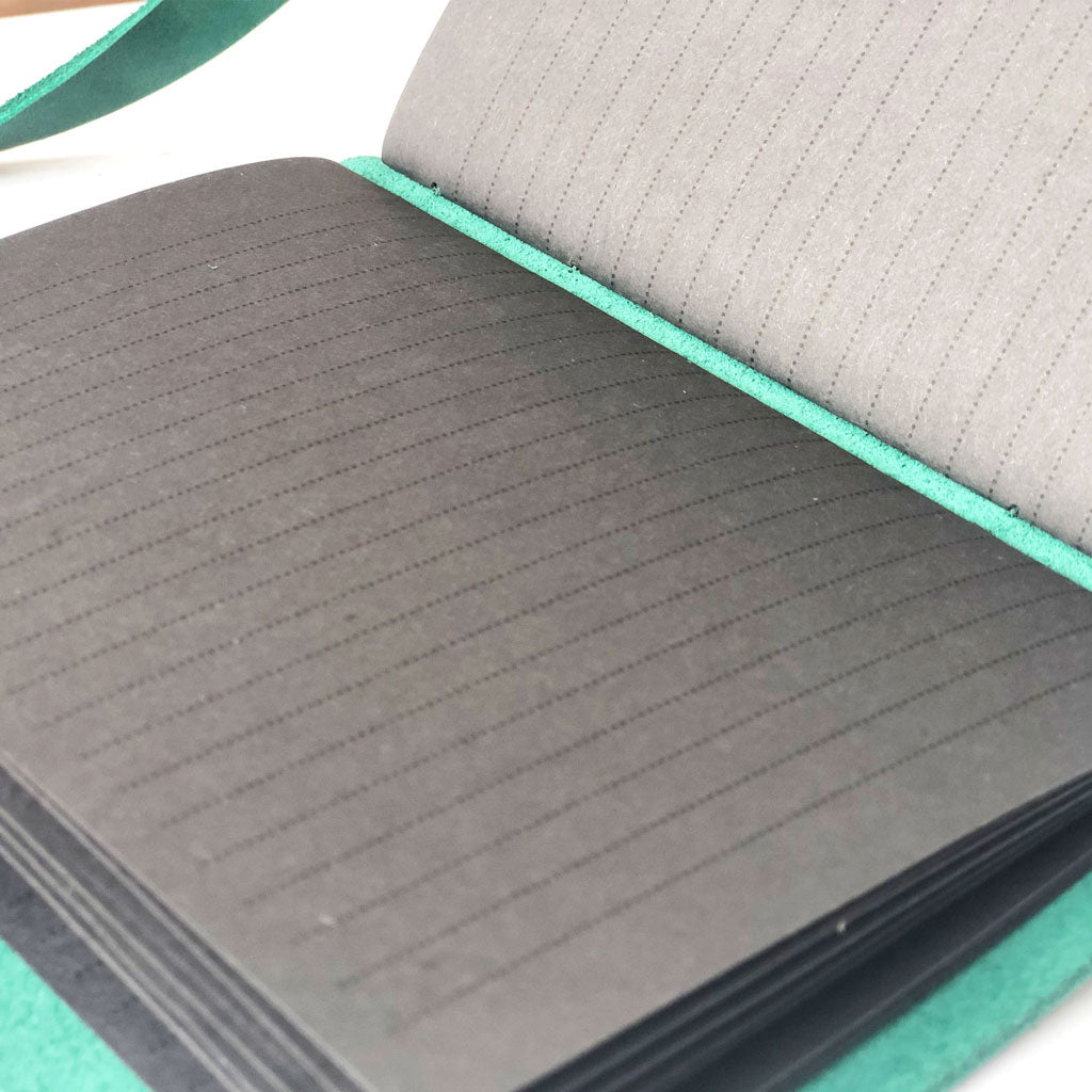 Lined black paper pages