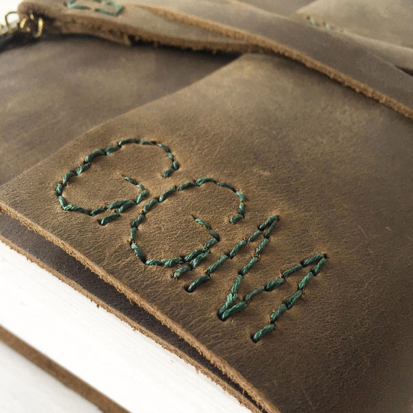 Brown leather monogrammed recipe book