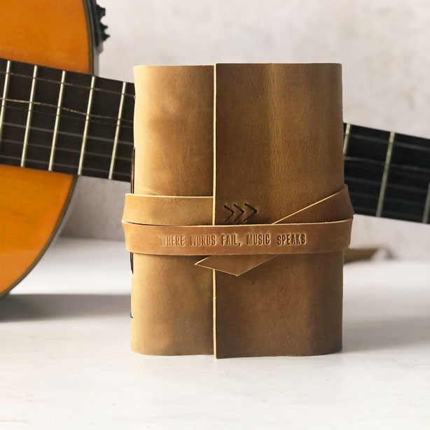 Where words fail, music speaks embossed leather music composition book