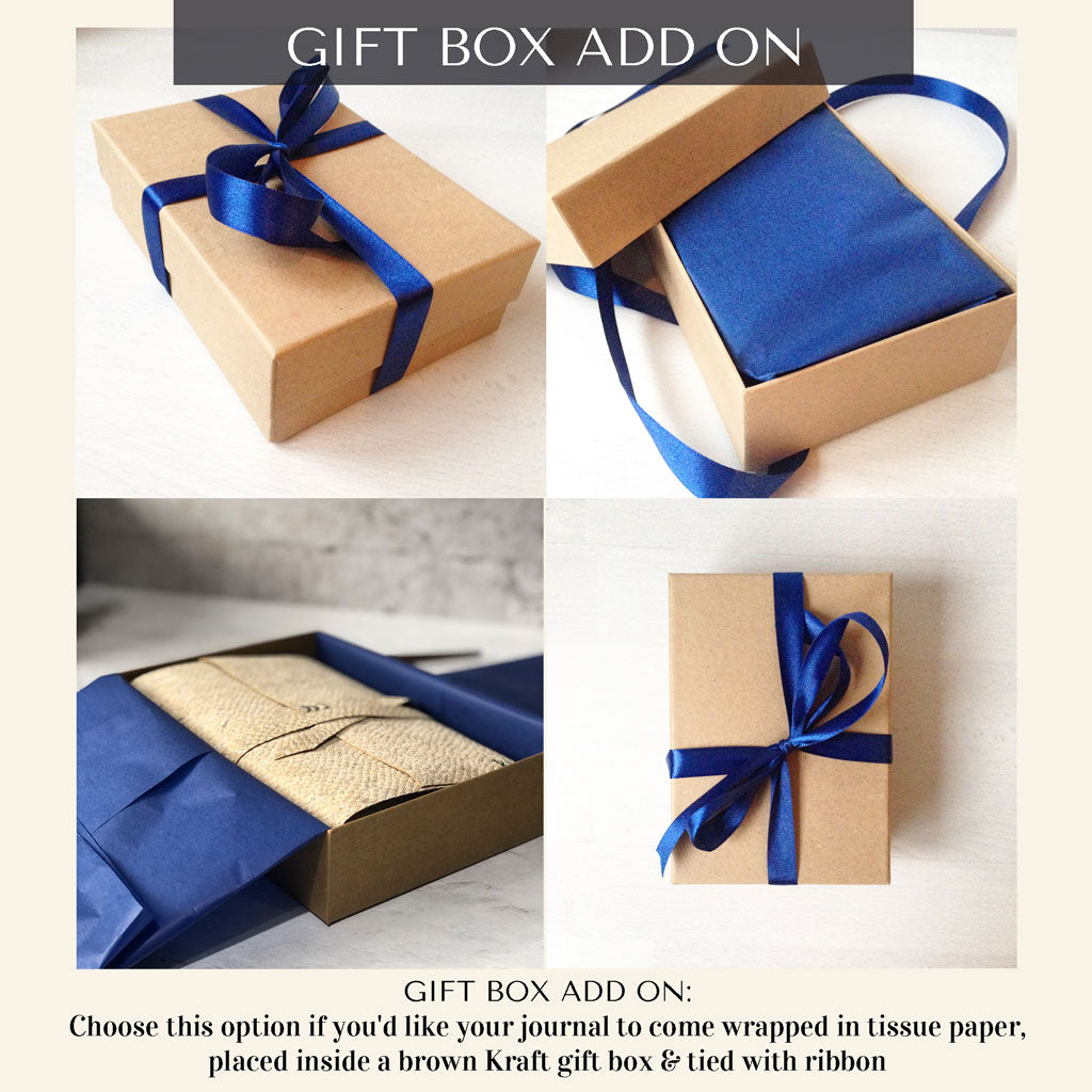 Brown Kraft gift box with blue ribbon and tissue paper on a white background