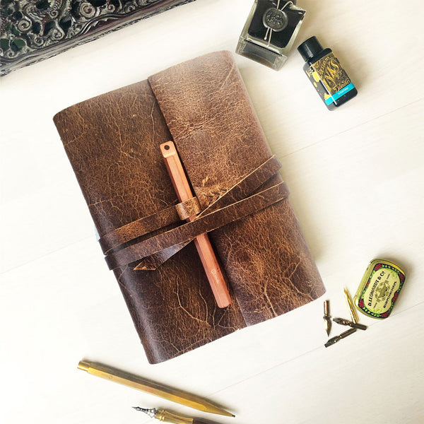 rustic brown leather sketchbook with pen loop
