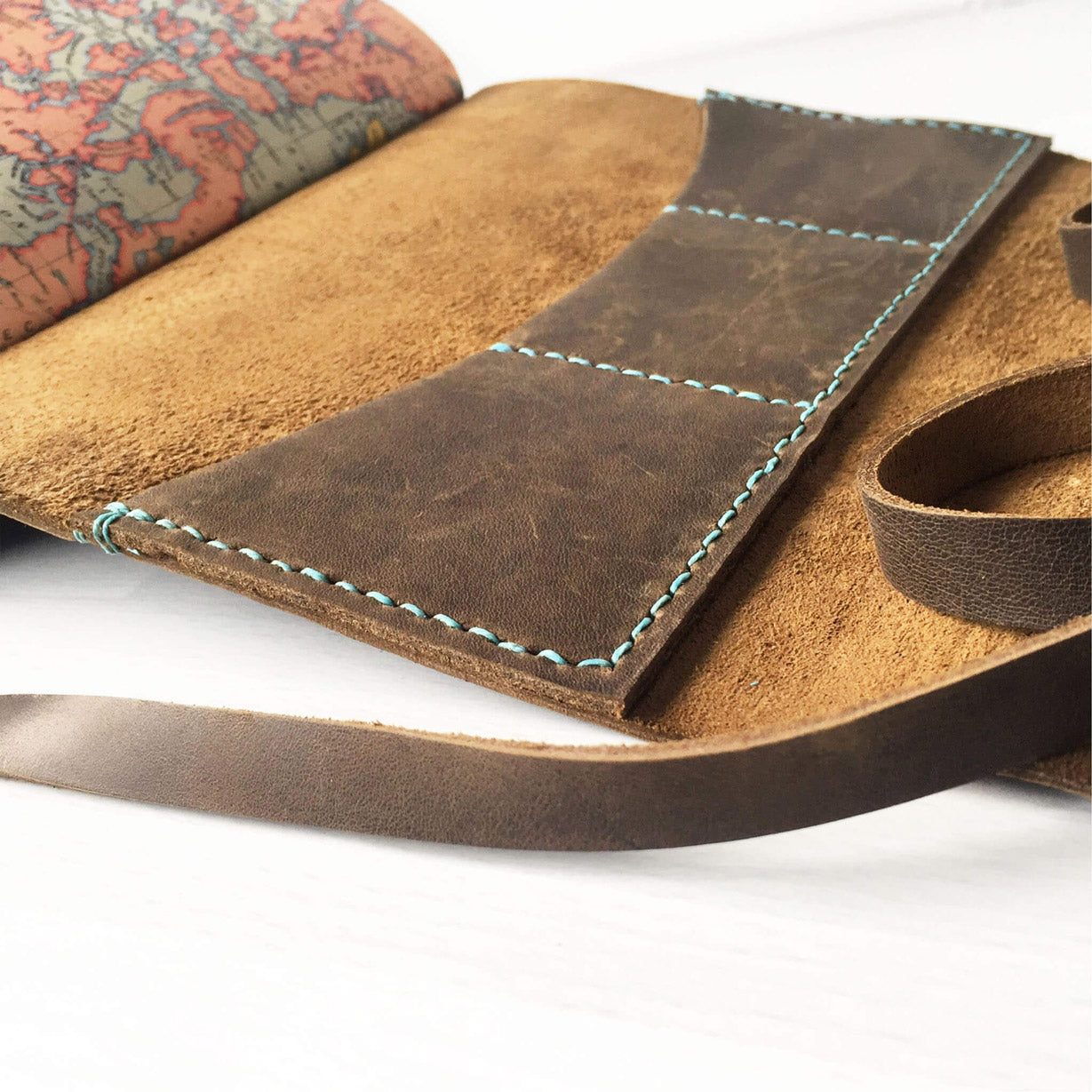 Open book view of  saddle stitched travelers notebook with card slots