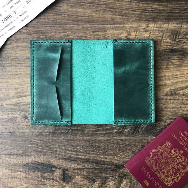 Green leather passport holder with card slots