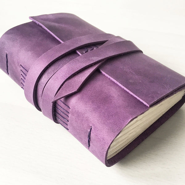 Purple leather bound book side view