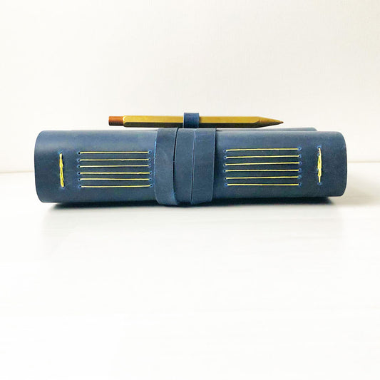 Blue leather sketchbook with pen