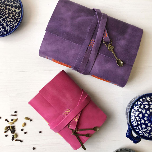 Pink and purple leather recipe books