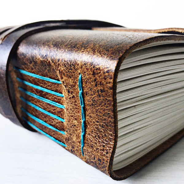Rustic brown leather teal stitching