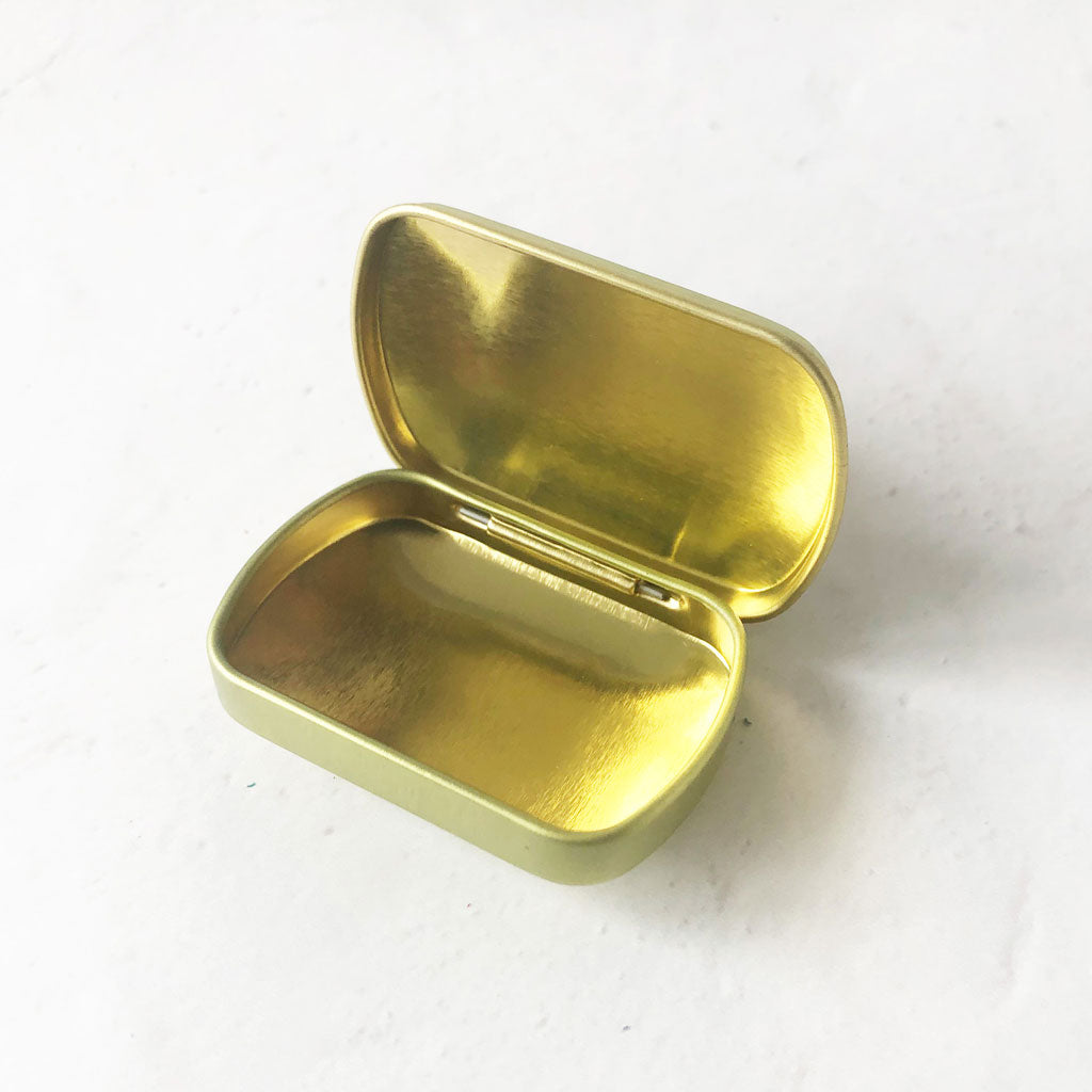 small metal tin with lid