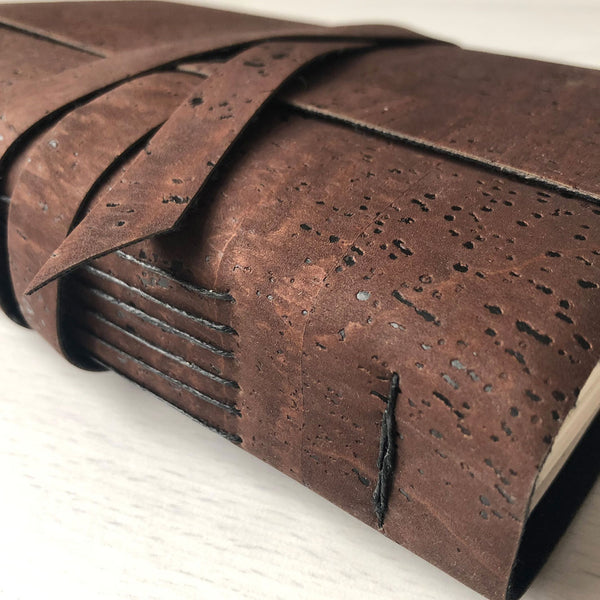 Brown faux leather, cork leather notebook close up