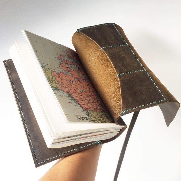 A5 brown leather travelers notebook with stitched card slots, back open view